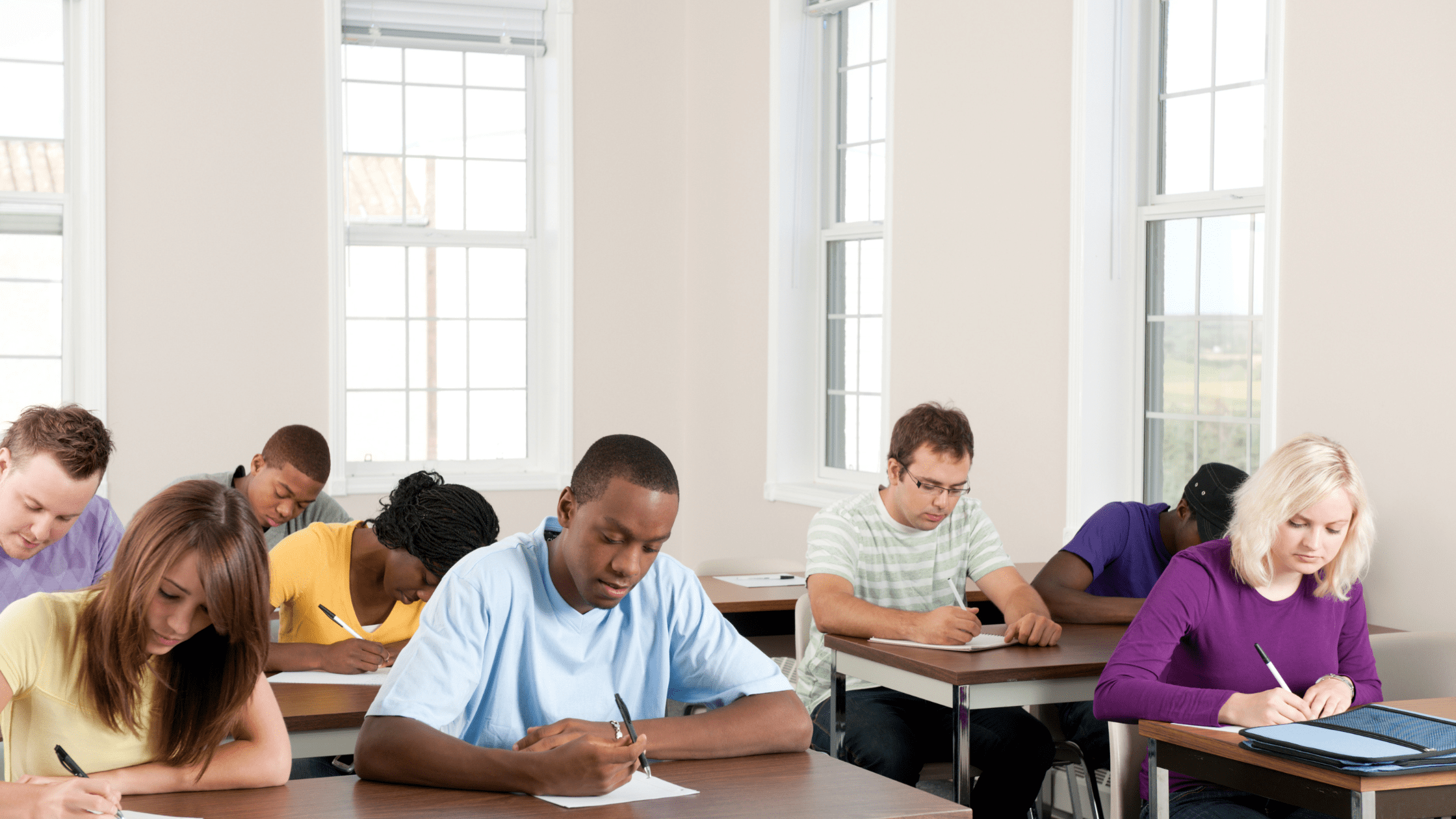 A group of pre-med students taking the MCAT in a testing center.